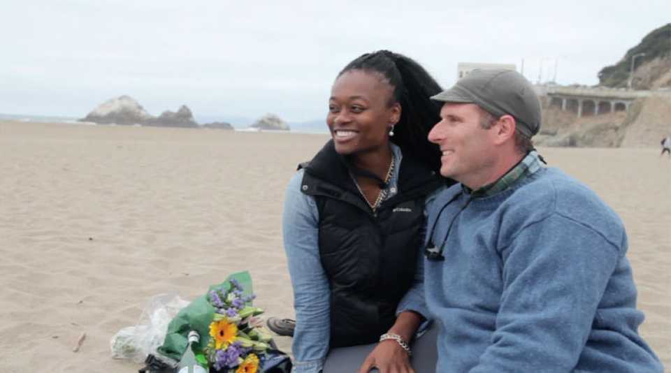 Blossom and Andrew at Ocean Beach with their electric bikes